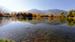 © vlocka - Picturesque autumn lake with clear water and mountain reflection