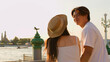 © blueringmedia - Young Asian Couple Enjoying Sunset View of Wat Arun Riverside