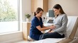 © ALLmost - A pregnant woman is having her belly examined by a healthcare professional in a medical examination room.