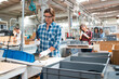 © bulentbaris - Woman working on an assembly line in a factory
