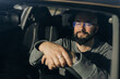 © Olga Moreira/Stocksy - Relaxed Bearded Man Sitting Inside Car with Eyes Closed
