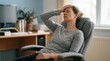 © Lester - Mature Woman Feeling Headachy And Tired While Sitting At Desk
