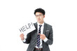 © DoThanhKhanh - Worried businessman holding HELP sign and pointing for support