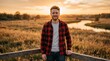 © DailyLens Studio - A young man in a plaid shirt posing in a natural sunlit environment.