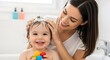 © Qii Stock - Loving Mother Gently Washing Little Baby Hair With White Foam In The Bathroom