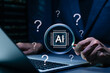 © Supatman - AI question analysis and artificial intelligence research concept. Person using laptop with magnifying glass, AI chip and question marks showing data discovery, problem solving, smart decision support