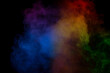 © Nikolay - Red and green steam on a black background.