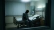 © eliyashevskiy - Blurred Silhouette Of A Lonely Patient Sitting On A Bed Through A Frosted Matte Glass