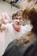 © Luciano Spinelli/Stocksy - Creative hairdresser Director Interacts With Model