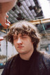© Luciano Spinelli/Stocksy - Portrait of z generation teen Getting a Haircut