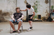 © Luciano Spinelli/Stocksy - Man Gets Haircut in Urban Workshop