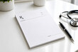© sonalisurymadhi - Blank prescription pad with pen in healthcare workspace, doctor office stationery and medical documentation concept. Ai generative