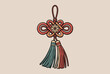 © Ripon - Traditional oriental decorative knot featuring intricate weaving and colorful tassels used for festive or cultural celebrations.