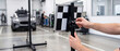 © MaksymFilipchuk - Technician adjusting ADAS calibration target for car sensor alignment in automotive service garage