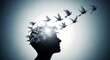 © Juhura - Silhouette of a human head with birds flying out of it in sunlight transparent background
