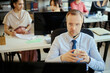 © DragonImages - Middle aged Caucasian businessman wearing headset, handling customer support in call center office with team. Suitable for customer service, sales support, CRM marketing