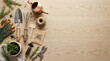 © celsi - Gardening tools and herbs on a wooden table with copy space