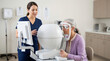 © Xenia - Elderly woman taking visual field test in ophthalmology clinic. Glaucoma diagnosis