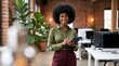 © Veggymulyanto - African American woman in office setting.