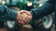 © vetrana - Business agreement between farmers and businessmen for tractor purchase in agribusiness setting