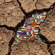 © Puthu - Cracked Earth Revealing Diverse National Flags - Global Unity Concept