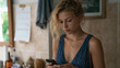 © forenna - A teenage girl in a rural bathroom quietly counts the days on a calendar taped to the wall, a worried expression revealing period poverty not through graphic content but through