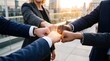 © Zabi - Diverse business professionals joining fists together for a teamwork success concept