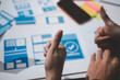 © Supanwadee - UI designer and UX developer brainstorm idea to design the application appearance in the early stage. Creative digital development agency. UX UI concept