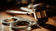 © KotBaton - Judge gavel beside metal handcuffs representing criminal justice, law enforcement, prosecution, arrest and courtroom proceedings.