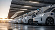 © Nusrat - Charging station with electric vans beneath a solar canopy, representing renewable energy use, sustainable logistics, and modern infrastructure for eco‑friendly fleet transportation solutions