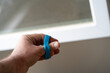 © Mihail - Close-up of hand using resistance bands for finger exercise and rehabilitation