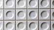 © Newleks - Seamless geometric background pattern made of white square ceramic tiles, featuring a distinctive three dimensional texture with a concave circular design on each tile module