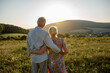 © Halfpoint - Senior couple on walk during sunset.