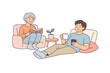 © Александр Михайлюк - Two family members relaxing together during calm weekend routine, comfortable seating and minimal props emphasizing togetherness