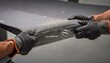 © DigitalSpace - Medium shot showing durablewash treated technical fabric being stretched emphasizing longlasting antistatic performance and resistance to wear in industrial applications.