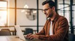 © twilight mist - Focused male entrepreneur typing on laptop keyboard in bright contemporary workspace with warm lighting