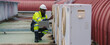 © YaMo - Technicians are inspecting the air conditioning and refrigeration systems in a commercial building.