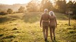 © Armando Loho - Senior couple walking together on a grassy hill at sunset with hope sign