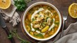 © LimeSky - Healthy orzo soup with lemon chicken, overhead shot.