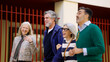 © DMegias - Four senior friends enjoying a lively conversation and walking together, sharing happiness and companionship on an urban street
