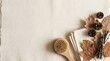 © ridhalex - Natural wooden body brush with folded cloths and dried autumn leaves on textured paper for sustainable skincare routines and seasonal organic spa promotions