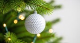 A white dimpled golf ball ornament hangs from a lush green pine branch, surrounded by soft glowing holiday lights and festive winter bokeh, craft, hobby, bauble