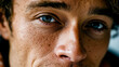 © Nikname - Close-up of a man's face with blue eyes and freckles