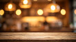© Zakia - Rustic dark wood table with blurred cafe bar background and hanging warm lamps for beverage product display mockup