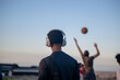 © rushay - Rear view of young man with headphones
