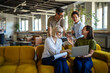 © Miljan Živković - Business people collaborating on project in creative office space