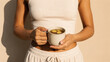 © Victoria - woman holding ceramic mug with hot ginger tea. Healthy lifestyle and wellness concept. Natural morning beverage for immunity boost and detox to promote body health and relaxation