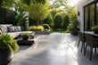 © mila103 - Modern outdoor seating arranged on tiled patio in garden