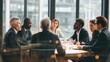 © Graphit Stocks - Diverse business team in a modern boardroom discussing strategy during a daytime meeting with city view