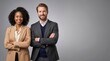 © ameliabusinessstock - Confident Business Couple Standing Arms Crossed Against